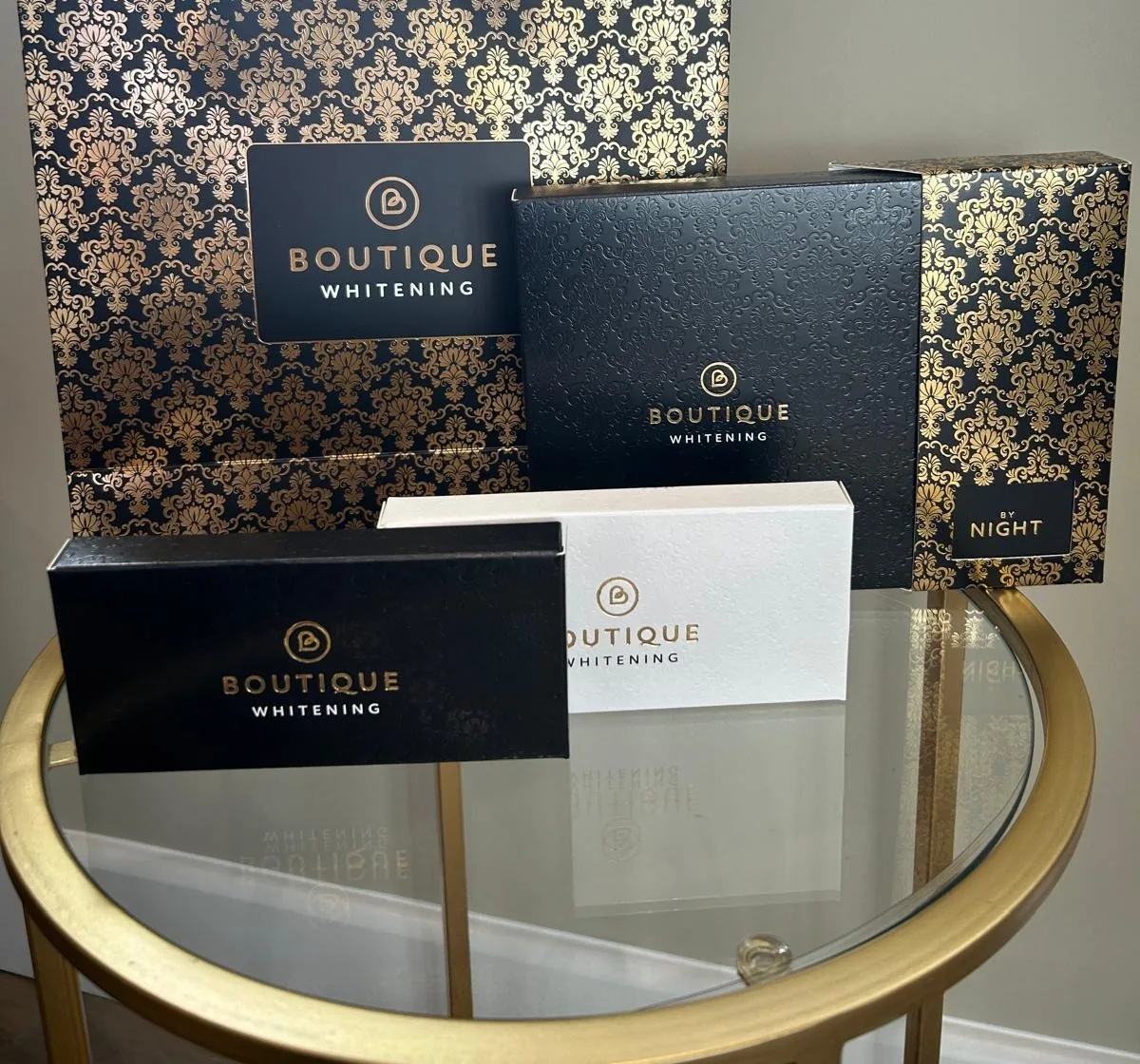 Boutique Whitening take-home whitening kits and packaging on a table in the practice